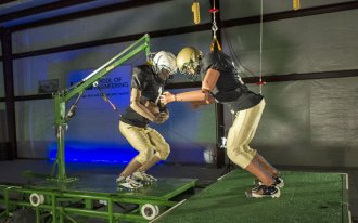 Dr. Dean Sicking has begun using crash-test dummies on a sled to better replicate impact from on-field collisions. (UAB)