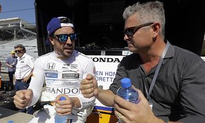 Fernando Alonso discusses tactics Gil de Ferran during a practice session for the Indianapolis 500