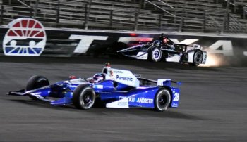 Takuma Sato (26), of Japan, drives by as Josef Newgarden crashes during the IndyCar auto race at Texas Motor Speedway, Saturday, June 10, 2017, in Fort Worth, Texas. (AP Photo/Larry Papke)