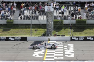 Will Power takes the checkered flag to win the ABC Supply 500 at Pocono Raceway Monday. (Mel Evans, AP)